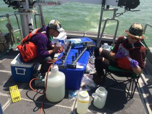 SNRE MS student Tonghui Ming and postdoc Kevin Meyer out for diel HABs sampling